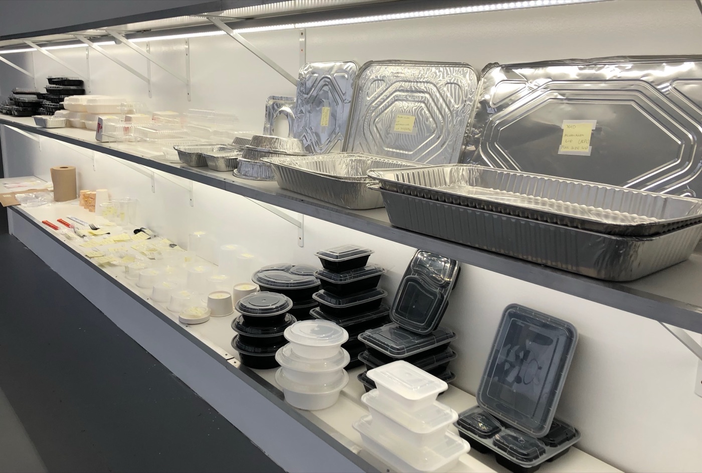 Inside the 333 Packaging Supply showroom in Cranston, RI — aluminum pans, to-go containers, cups, and supplies in stock